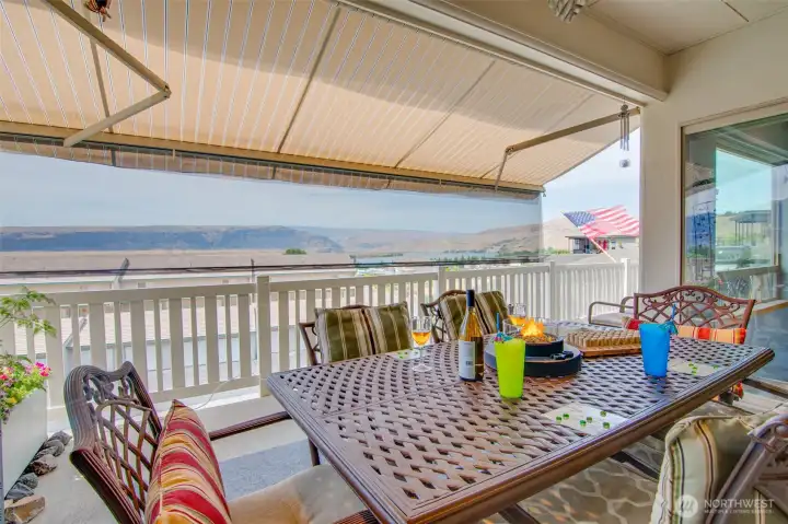 Entertainment sized covered deck with awning/sun screen for privacy and taking the heat of the summer more enjoyable.