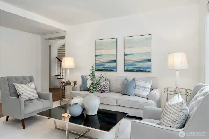 Welcoming formal living room designed for meaningful conversations, quiet evenings, and effortless entertaining, with fresh interior paint, plush new carpeting, and timeless style.