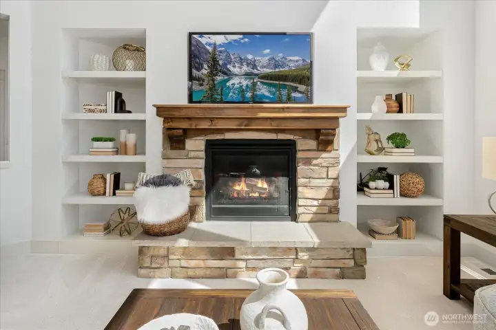 Crafted for both beauty & comfort, the impressive gas-burning fireplace is framed by custom built-ins and timeless stonework, creating a warm, elegant focal point that brings everyone together.