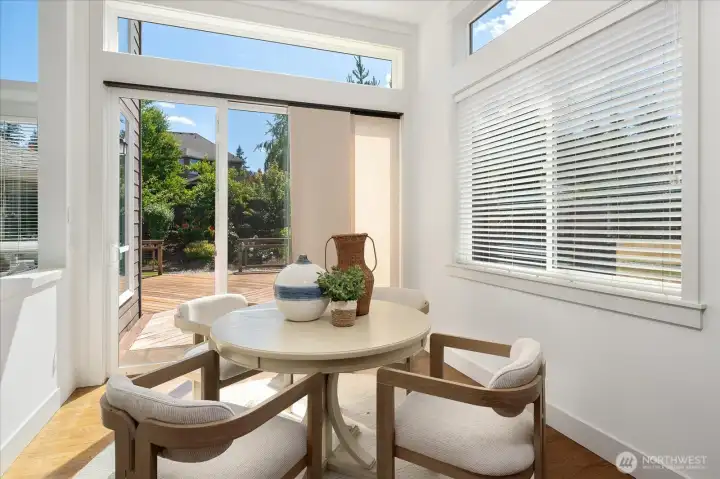 Perfectly positioned beside the kitchen, the charming Morning Room offers abundant natural light, serene backyard views, and direct access to the deck for effortless indoor-outdoor living.