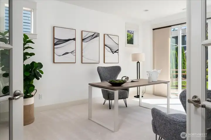 Behind elegant French doors, the private main-level office is bathed in natural light and offers exceptional flexibility as a refined home office or spacious fifth bedroom—ideal for guests, remote work, or multigenerational living.