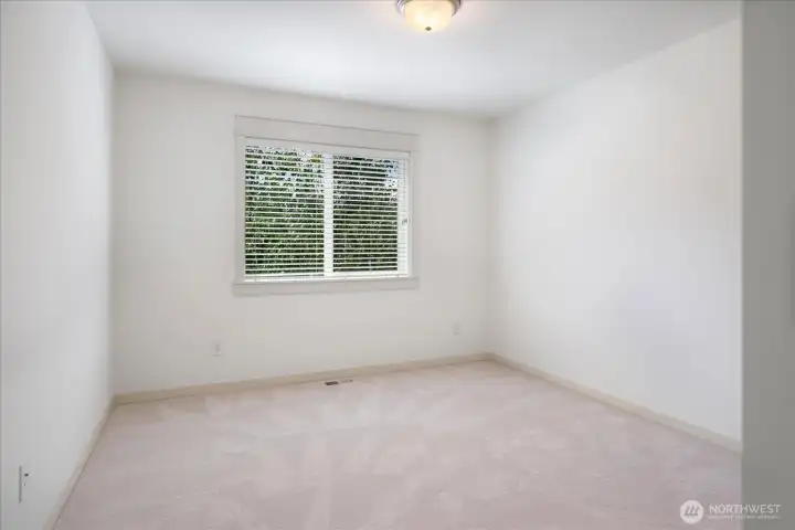 Bedroom # 3 Comfort and simplicity come together, showcasing fresh interior paint, new carpet, and a bright, airy ambiance.