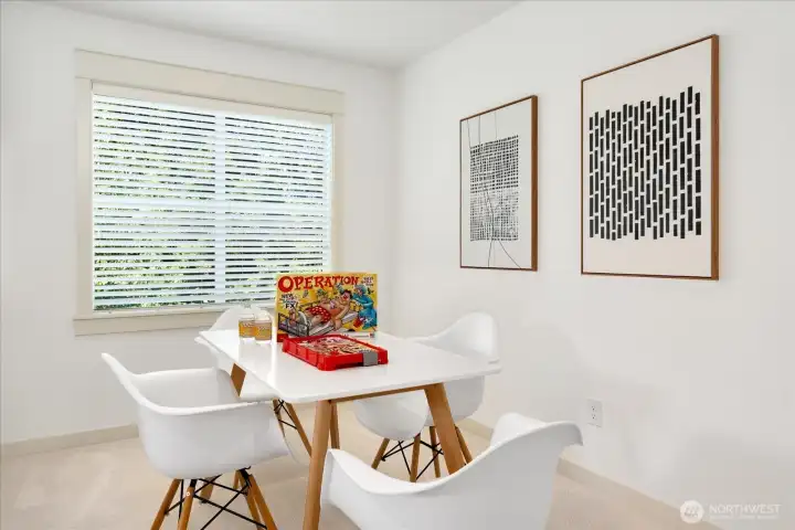 Dedicated flex space within the expansive bonus room, perfect for board games, crafts, homework, or a quiet reading nook—showcasing the incredible versatility of this upper-level retreat.