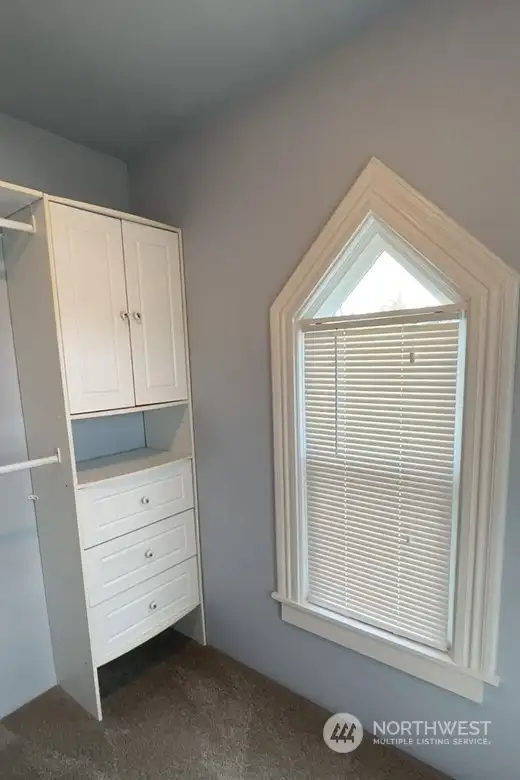 A look at a small portion of the Master Bedroom WALK-IN CLOSET w/natural light.