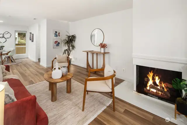 Living room with wood-burning fireplace.