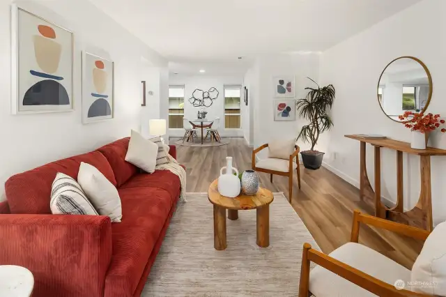 Living room flows seamlessly to the dining room/kitchen.