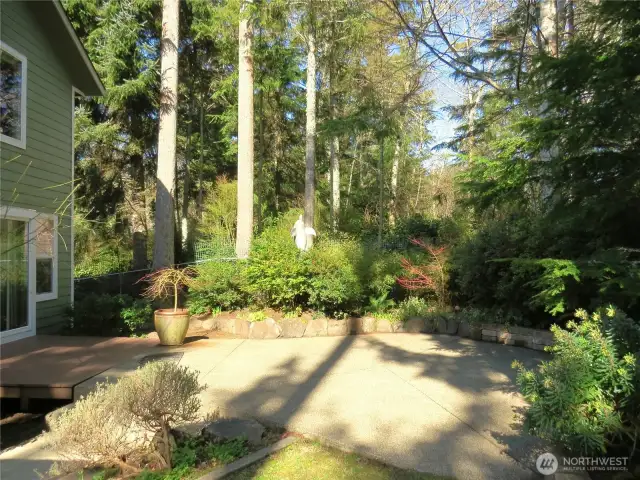 Then we approach the rear deck and patio, which will lead into the primary suite on the main floor of the home.