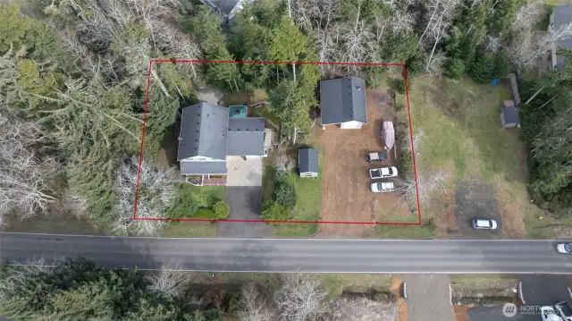 Property sits on not one, but two, secluded wooded parcels on the desirable east side of Ocean Shores.