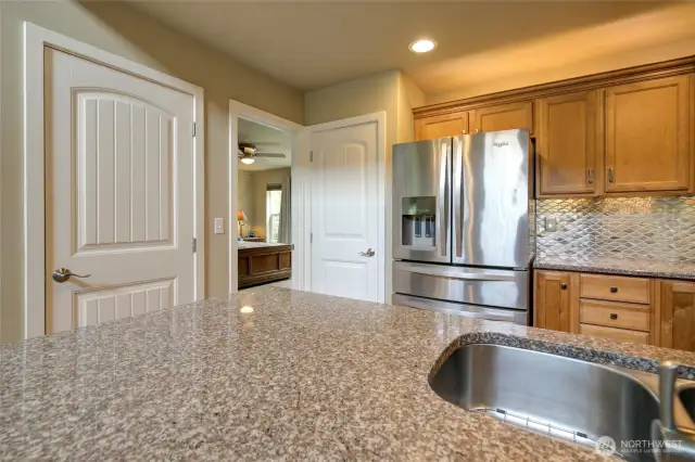 Just past the kitchen, is the primary suite.