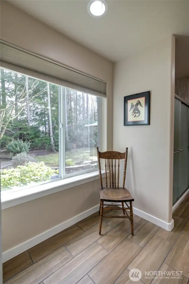 The dressing area then leads to bathroom.