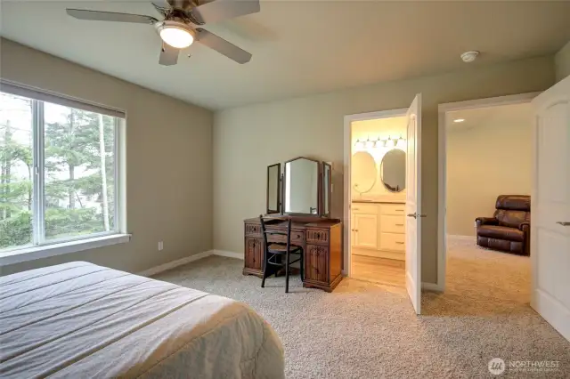 The upstairs bathroom is accessed from both the bedroom and the hallway.