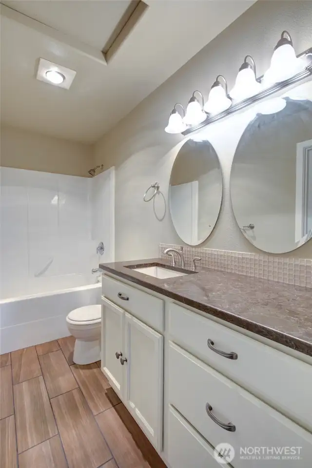 Full bath and dual vanity are upstairs.