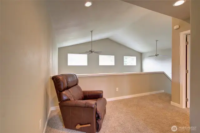 Exit the bathroom onto the loft/landing area.