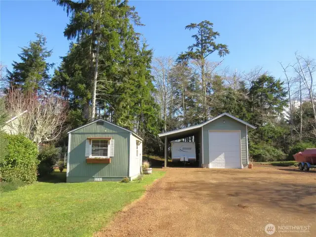 Approaching the second lot, we find a large RV shop and finished outbuilding, formerly used as an art studio.