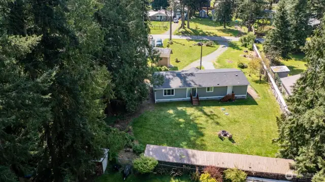 Ariel shot of back yard looking over house towards the front yard.
