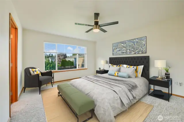 The spacious primary bedroom features large windows and a ceiling fan, offering both comfort and natural light. It includes a walk-in closet and an ensuite bath with double vanities, new quartz countertops, and new sinks. Relax in the soaking tub or enjoy the bright, modern feel of the glass-enclosed shower, creating a spa-like atmosphere perfect for unwinding.
