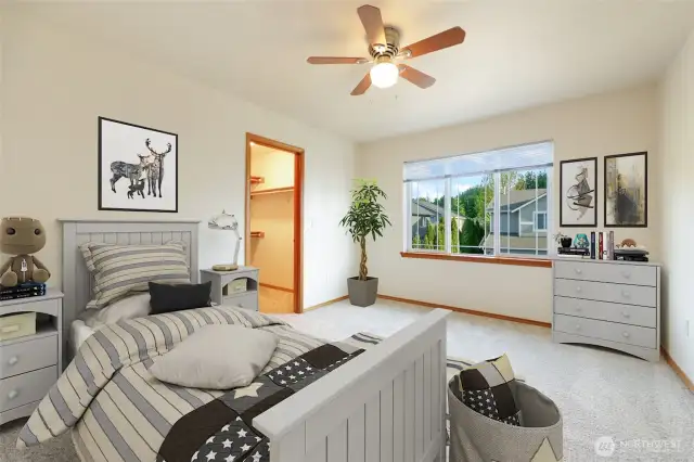 The second bedroom is bathed in natural light, creating a serene and inviting atmosphere, perfect for rest or reflection. A walk-in closet awaits, offering not just storage, but a space to indulge in organization and style providing a touch of elegance and convenience that elevates your everyday living experience. All bedrooms have ceiling fans.