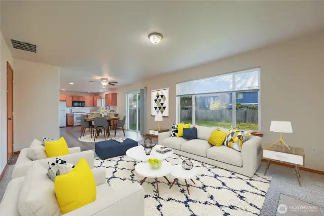 A picture-Perfect Home! Large windows bathe the room in natural light, while the slider door opens to a private, peaceful backyard, extending your living space and bringing the outdoors in.