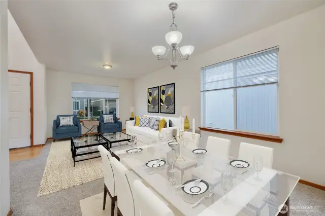 The gorgeous formal dining room flows effortlessly into the expansive room with the living room, enhancing the home's modern, open concept feel. Soft neutral-toned interior paint creates a timeless backdrop, ready to complement any style. Throughout space, elegance and comfort reign, offering a perfect balance for both relaxed living and refined entertaining.