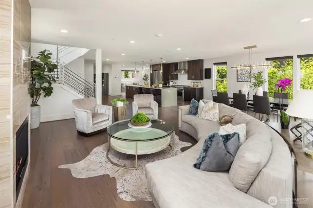 Spacious living and dining spaces flow around a grand epicurean kitchen.