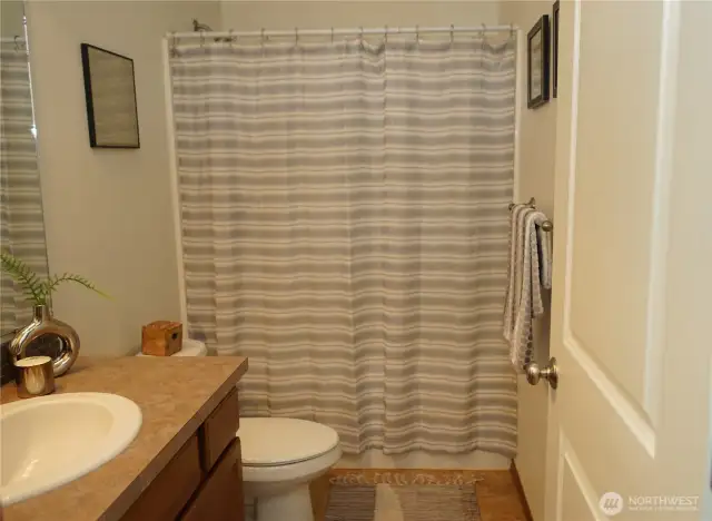 Main bath with tub/shower combo.