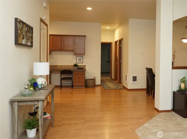 Just inside the door you have the living room to the right, primary bedroom to the left and kitchen straight ahead.