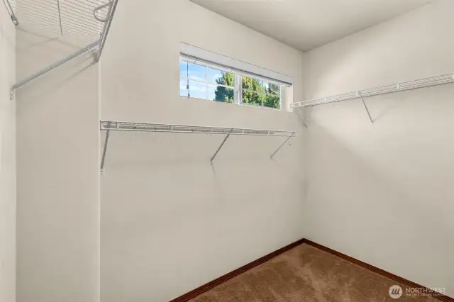 Walk-in closet in primary bedroom