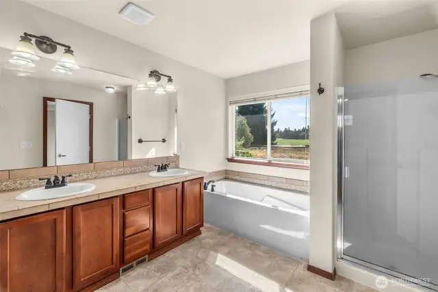 Primary bath showing showing both tub and shower