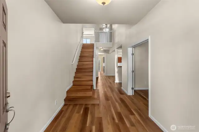 From front door. Office/den on right with double door.