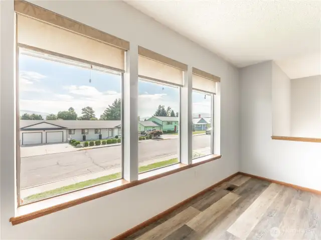 Main floor living area with picture windows