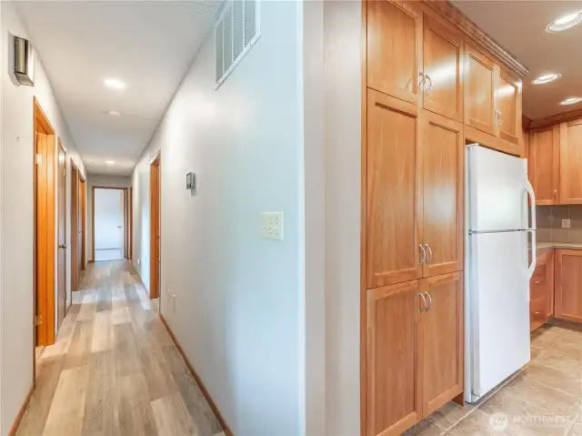 Main floor kitchen and hallway to bedrooms and bathrooms
