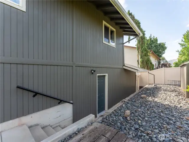 Back of the house with the garage door heading out back
