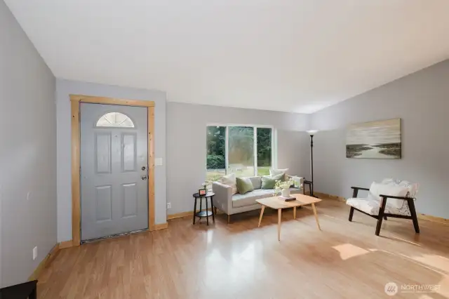 Bright front entry opening to spacious living room.
