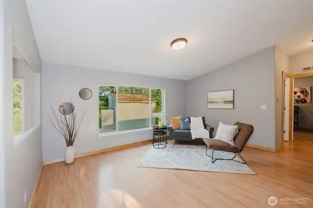 Living area with large windows and natural light.