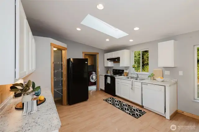 Kitchen with backyard access and open feel.