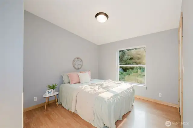 Bright guest bedroom with natural light.