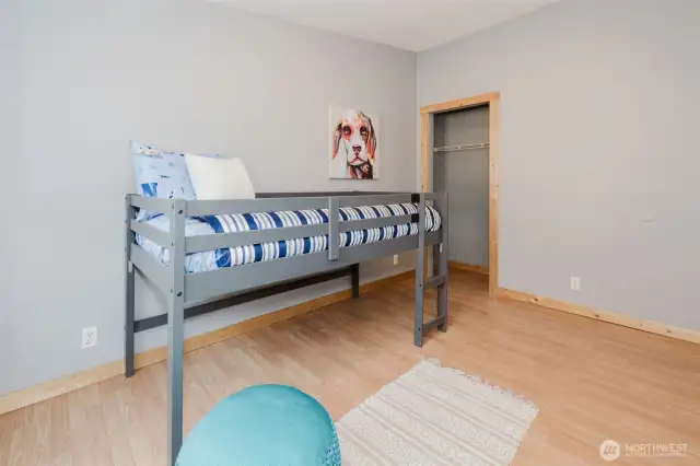 Bedroom with space for bunks or guest setup.