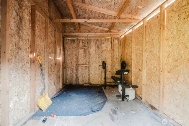 Interior view of storage shed or workshop space.