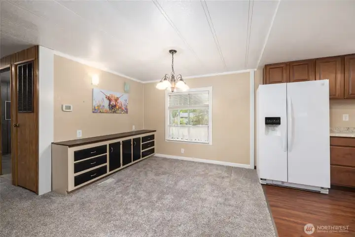 Formal dining area next to the kitchen features a built-in buffet for extra storage.