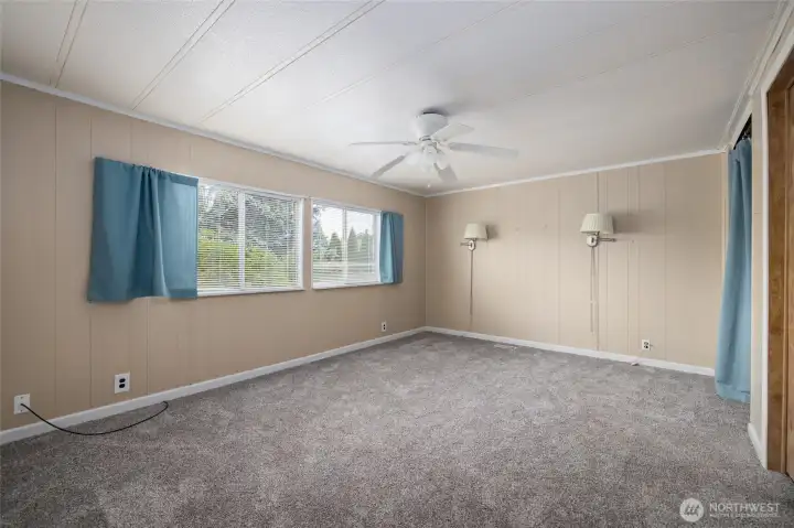 Spacious primary bedroom at the end of the hallway.