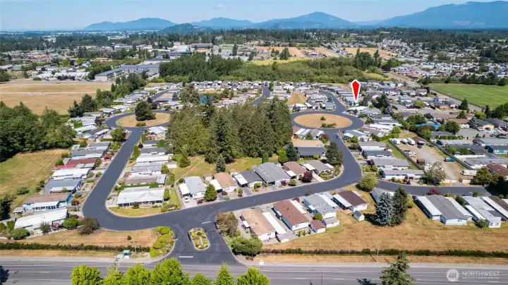 An aerial view of the Park Village community with #98 location marked with the red arrow.
