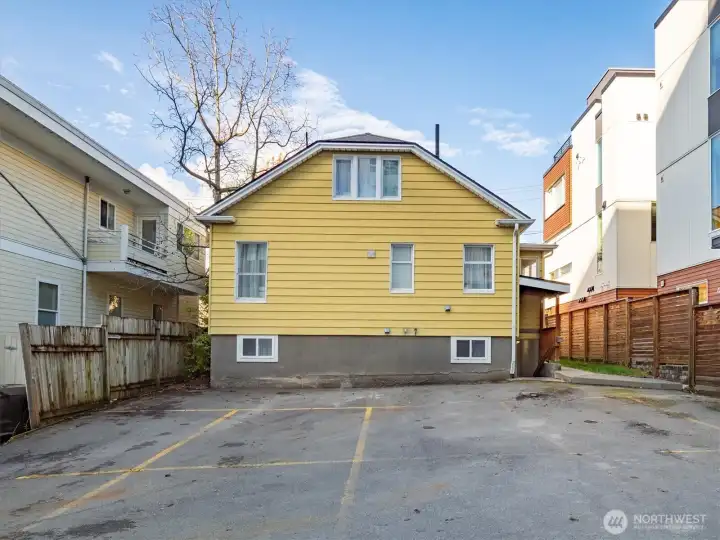 The backyard has space to comfortably park 8 cars.
