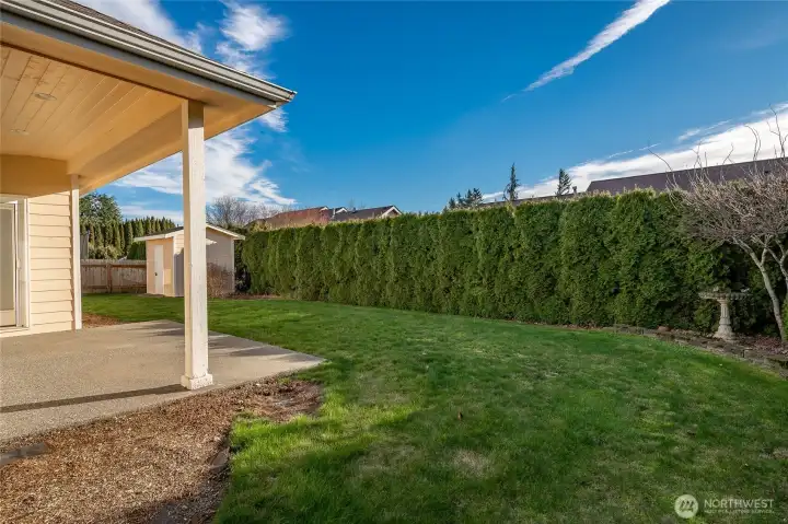 Low maintenance private backyard with covered patio