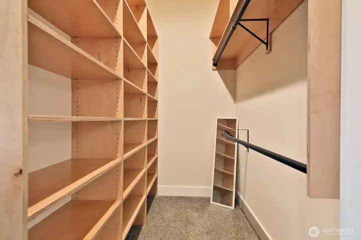Primary walk-in closet Primary walk-in closet