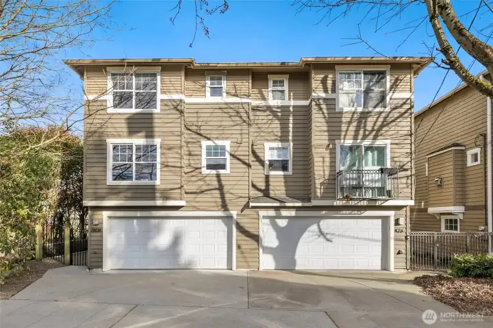 A rare find in this neighborhood: a spacious townhome (not skinny!) with a two-car attached garage and great space configurations throughout. 2201 is the left townhome, corner lot.