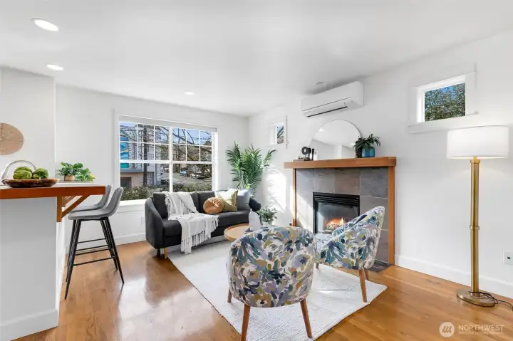 Generously sized family room just off the kitchen features a gas fireplace — ideal for everyday living. Mini split here for warm weather as well!