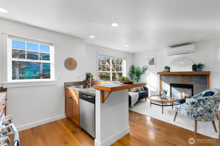 Natural light pours in with this fantastic western exposure while the gas fireplace anchors the adjacent family room.
