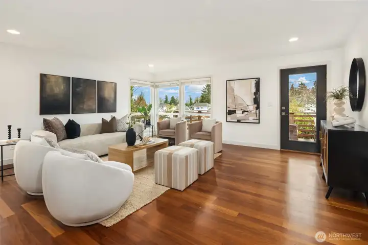 African Iroko wood flooring adds warmth and richness to the main living spaces, while the connected living, dining, and kitchen areas create an easy flow for both everyday life and entertaining.