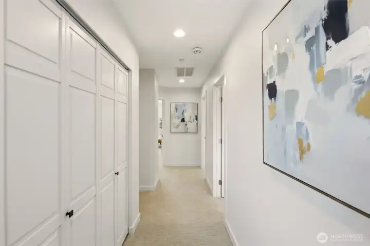 Upper level: To the left is a large linen closet and full hall bath. At the end to the left is the Owners Suite, to the right are the large 2nd & 3rd bedrooms. Once again, all new quality carpet, trim/millwork, doors, hardware, lighting - everything!