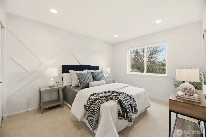 Bedroom 3. Check out the amazing custom wall! This large bedroom overlooks the back yard.